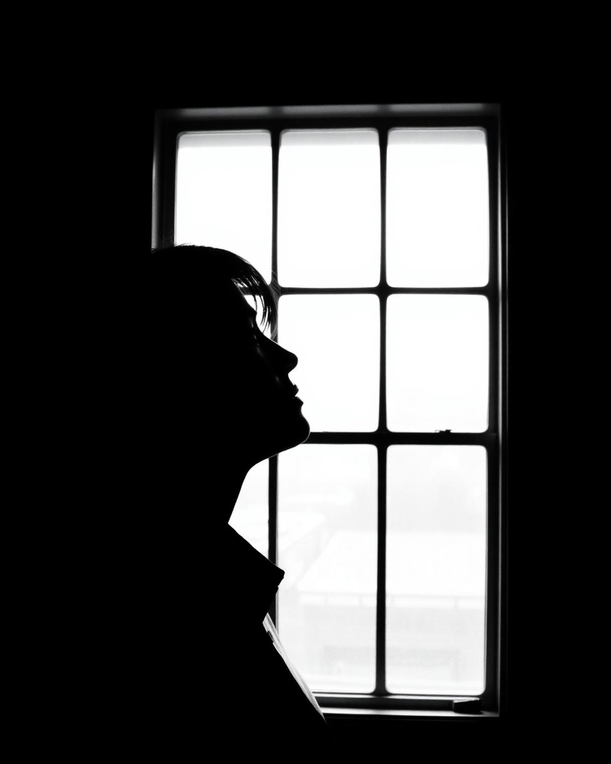 Silhouette against a bright window